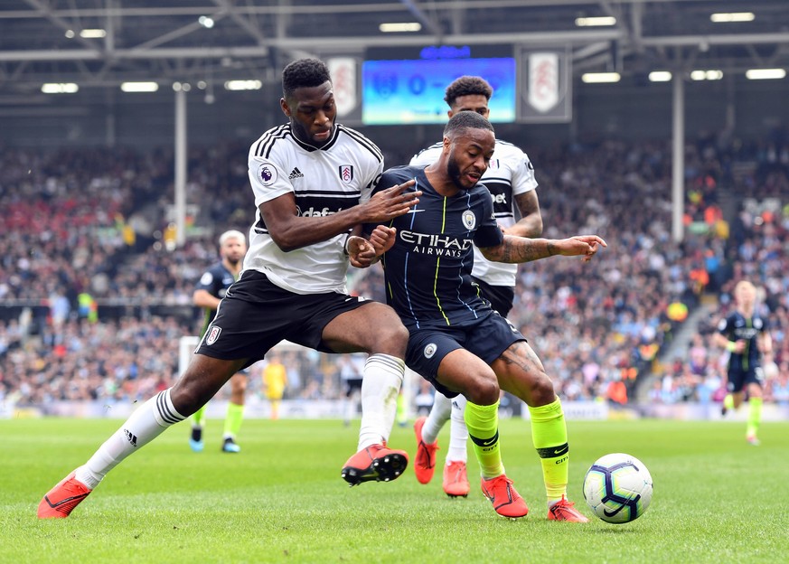 Football - 2018 / 2019 Premier League - Fulham vs. Manchester City Manchester City s Raheem Sterling holds off the challenge from Fulham s Timothy Fosu-Mensah, at Craven Cottage. COLORSPORT/ASHLEY WES ...