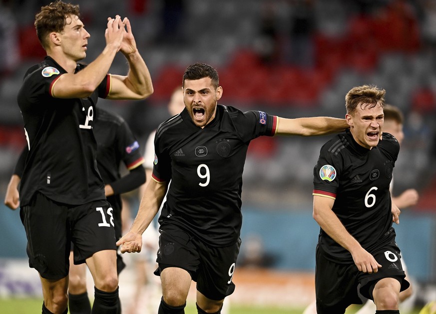 Germany&#039;s Leon Goretzka, left, celebrates with teammates after scoring his side&#039;s second goal during the Euro 2020 soccer championship group F match between Germany and Hungary at the Allian ...