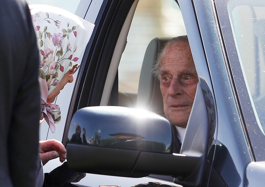 FILE PHOTO: Britain&#039;s Queen Elizabeth speaks to Prince Philip at the Royal Windsor Horse Show, in Windsor, May 11, 2018. REUTERS/Peter Nicholls/File Photo