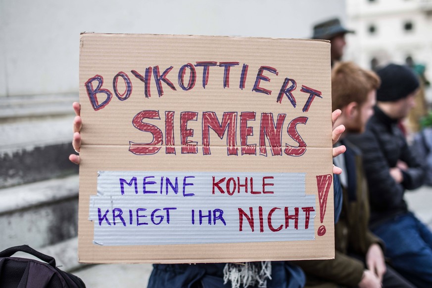 January 13, 2020, Munich, Bavaria, Germany: In response to the reconfirmation by Siemens to build switching systems for the Adani-Carmichael coal mine in Australia, spontaneous protests throughout Ger ...