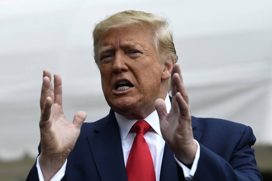 President Donald Trump talks to reporters on the South Lawn of the White House in Washington, Friday, Oct. 25, 2019. Trump is heading to South Carolina for an event at Benedict College. (AP Photo/Susa ...