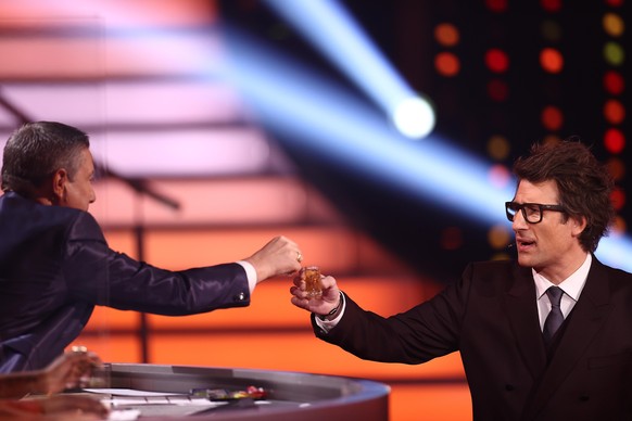 COLOGNE, GERMANY - MARCH 12: Host Daniel Hartwich and Juror Joachim Llambi toast with a glass of Schnapps during the 2nd show of the 14th season of the television competition &quot;Let&#039;s Dance&qu ...