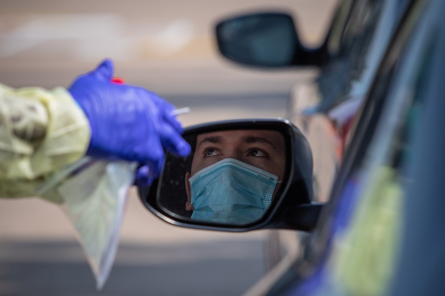 A man prepares to be tested at a coronavirus disease (COVID-19) drive-in testing location in Houston, Texas, U.S., August 18, 2020. REUTERS/Adrees Latif