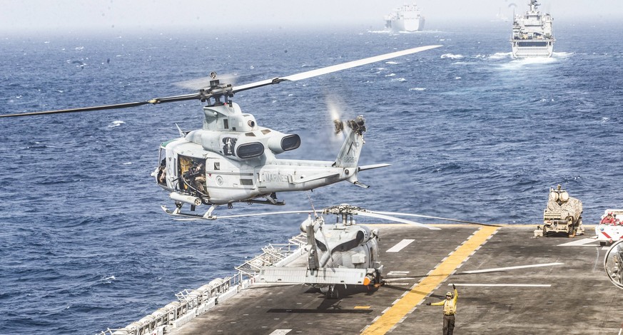 July 18, 2019, Strait Of Hormuz: A US miltary helicopter takes off from the flight deck of the Boxer, an amphibious assault ship, in the Strait of Hormuz on Thursday. Iran announced it has captured a  ...
