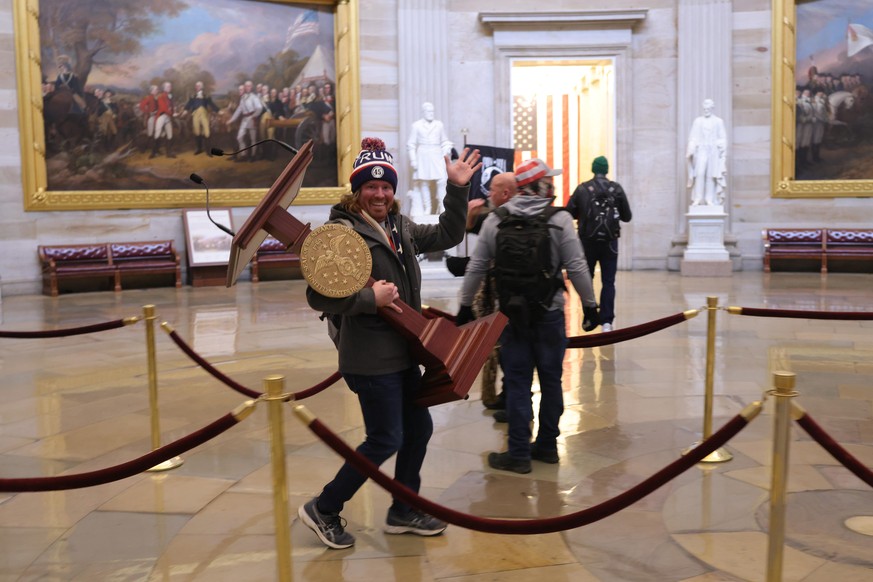 WASHINGTON, DC - JANUARY 06: Protesters enter the U.S. Capitol Building on January 06, 2021 in Washington, DC. Congress held a joint session today to ratify President-elect Joe Biden&#039;s 306-232 El ...