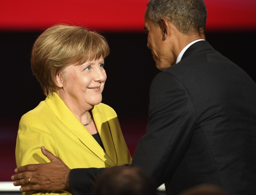 HANOVER, GERMANY - APRIL 24: U.S. Barack Obama greets German Chancellor Angela Merkel at the opening evening of the Hannover Messe trade fair on April 24, 2016 in Hanover, Germany. Obama met with Germ ...
