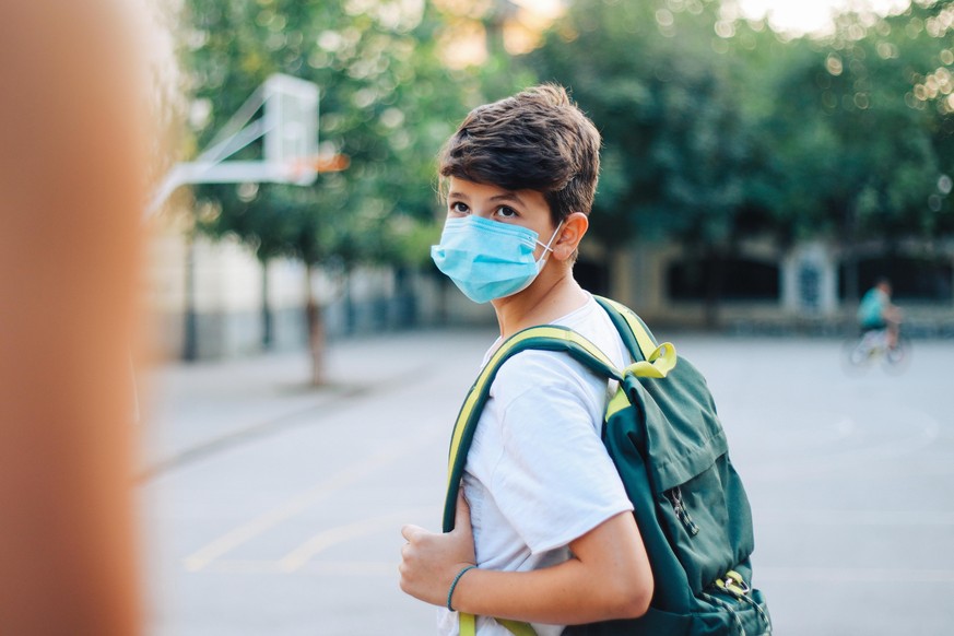 Kid going to school during the coronavirus pandemic.