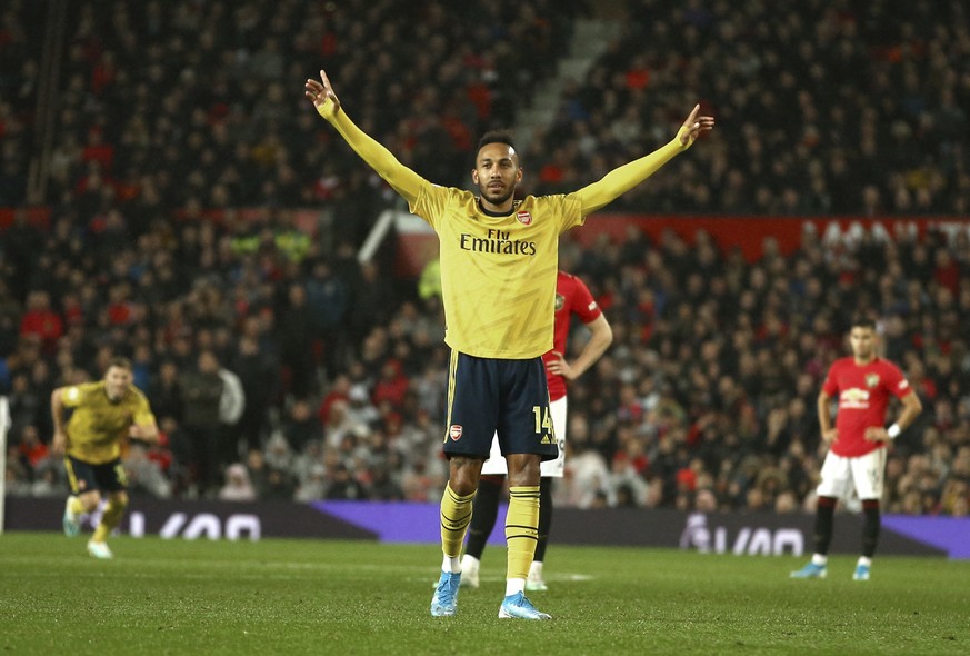Arsenal&#039;s Pierre-Emerick Aubameyang celebrates after scoring the opening goal during the English Premier League soccer match between Manchester United and Arsenal at Old Trafford in Manchester, E ...