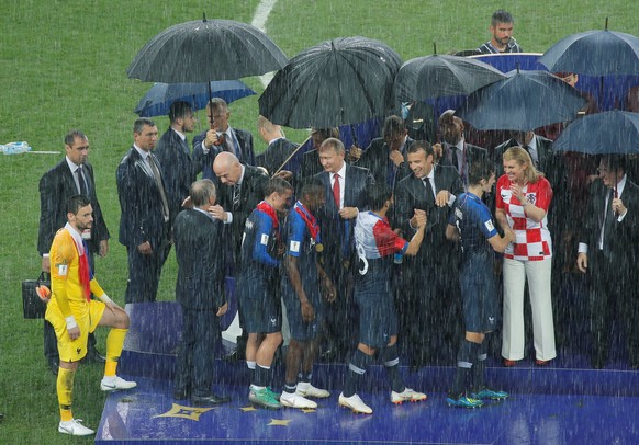 Soccer Football - World Cup - Final - France v Croatia - Luzhniki Stadium, Moscow, Russia - July 15, 2018 France players receive their winners medals from FIFA president Gianni Infantino, President of ...