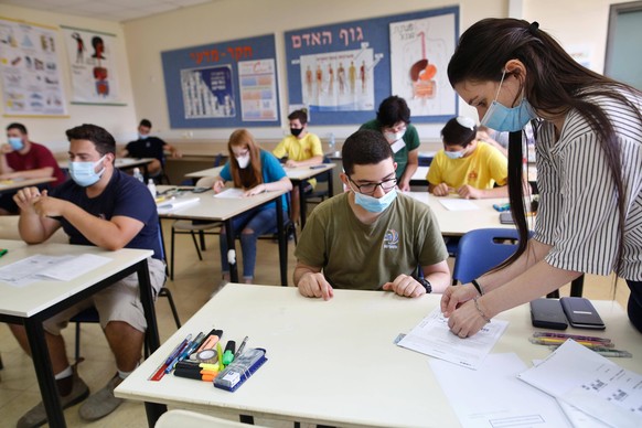 200629 -- MODIIN, June 29, 2020 Xinhua -- Israeli high school students wearing face masks take part in the graduation exam amid the COVID-19 pandemic in central Israeli city of Modiin, June 29, 2020.  ...