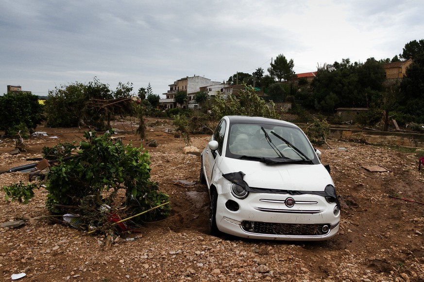 A car on a destroyed crop after flooding in Sant Llorenc, 60 kilometers (40 miles) east of Mallorca&#039;s capital, Palma, Spain, Wednesday, Oct. 10, 2018. Torrential rainstorms that caused flash floo ...