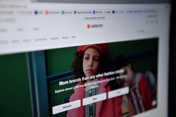The online fashion portal Zalando is pictured on a laptop on April 30, 2020 in London. - Farewell suits and high heels and welcome jogging trousers and slippers as consumers adopt a more relaxed appro ...