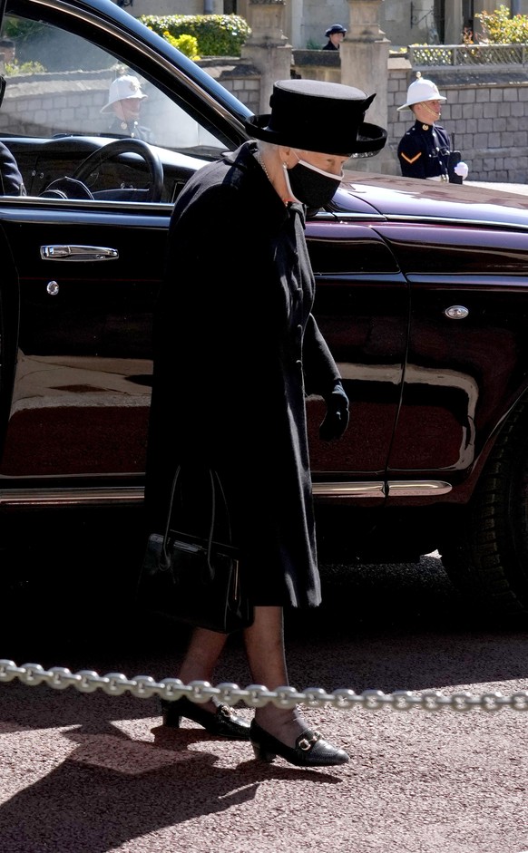 WINDSOR, ENGLAND - APRIL 17: Queen Elizabeth II arrives for the funeral of her husband Prince Philip, Duke of Edinburgh at St George&#039;s Chapel at Windsor Castle on April 17, 2021 in Windsor, Engla ...