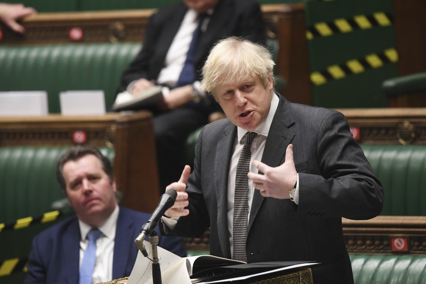 In this photo provided by UK Parliament, Britain&#039;s Prime Minister Boris Johnson speaks during the debate in the House of Commons on the EU (Future Relationship) Bill in London, Wednesday, Dec. 30 ...