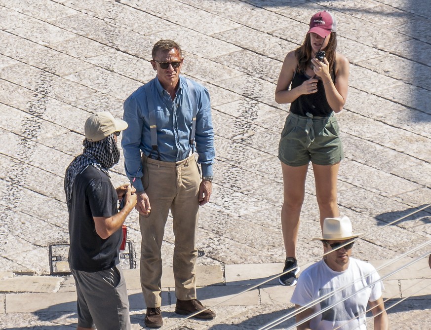 In this Sept. 12, 2019 photo, actor Daniel Craig, second from left, is seen on the set of the latest James Bond movie &#039;No time to die&#039; in Matera, southern Italy. The film is due out in sprin ...