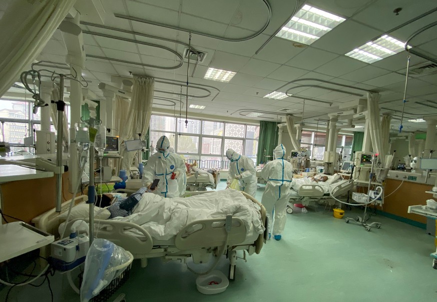 Pictures uploaded to social media on January 25, 2020 by the Central Hospital of Wuhan show medical staff attending to patients, in Wuhan, China. THE CENTRAL HOSPITAL OF WUHAN VIA WEIBO /via REUTERS T ...