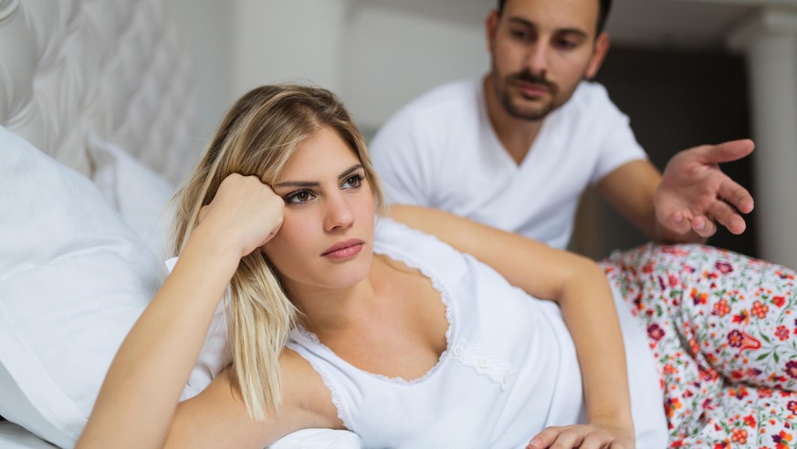 Young unhappy couple having problems in their relationship