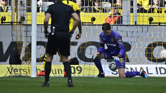Dortmund goalkeeper Marwin Hitz lets a shot from Duesseldorf&#039;s Oliver Fink slip between his legs to tie the game 1-1 during the German Bundesliga soccer match between Borussia Dortmund and Fortun ...