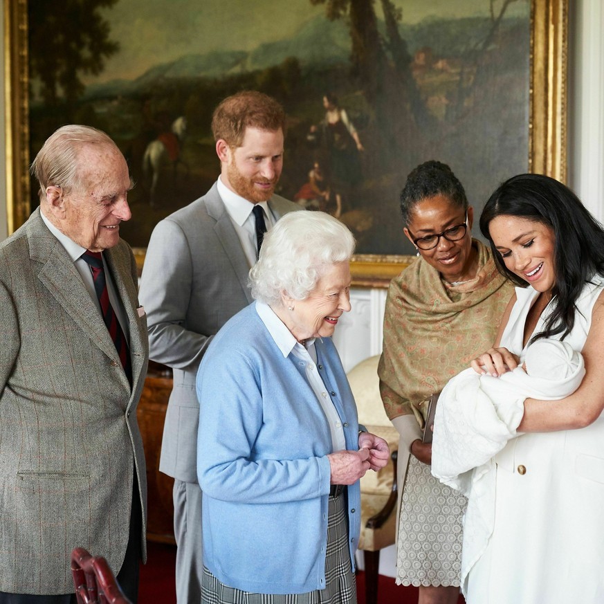 In this image made available by SussexRoyal on Wednesday May 8, 2019, Britain&#039;s Prince Harry and Meghan, Duchess of Sussex, joined by her mother Doria Ragland, show their new son to Queen Elizabe ...