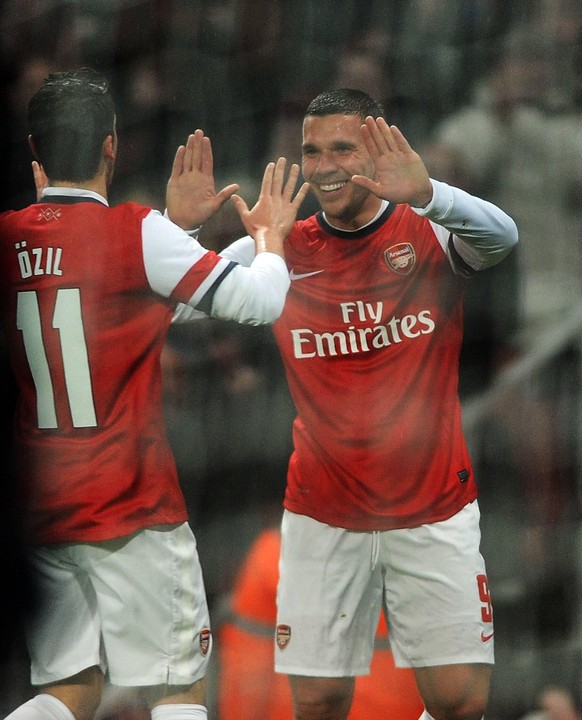 Football - 2013 / 2014 FA Cup - Fourth Round: Arsenal vs. Coventry City Arsenal s Lukas Podolski celebrates scoring goal no 1 with Mesut �zil at The Emirates. COLORSPORT/ANDREW COWIE PUBLICATIONxNOTxI ...
