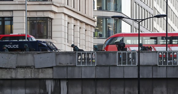 Police officers walk along London Bridge in London, Friday, Nov. 29, 2019. British police shot a man on London Bridge in the heart of Britain&#039;s capital on Friday after a stabbing that left severa ...