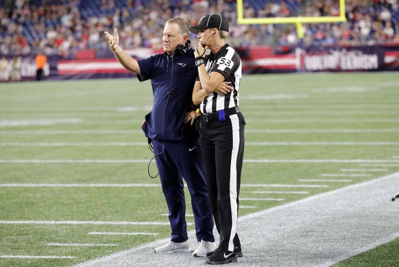 FOXBOROUGH, MA - AUGUST 29: New England Patriots head coach Bill Belichick makes a point with down judge Sarah Thomas (53) during a game between the New England Patriots and the New York Giants on Aug ...