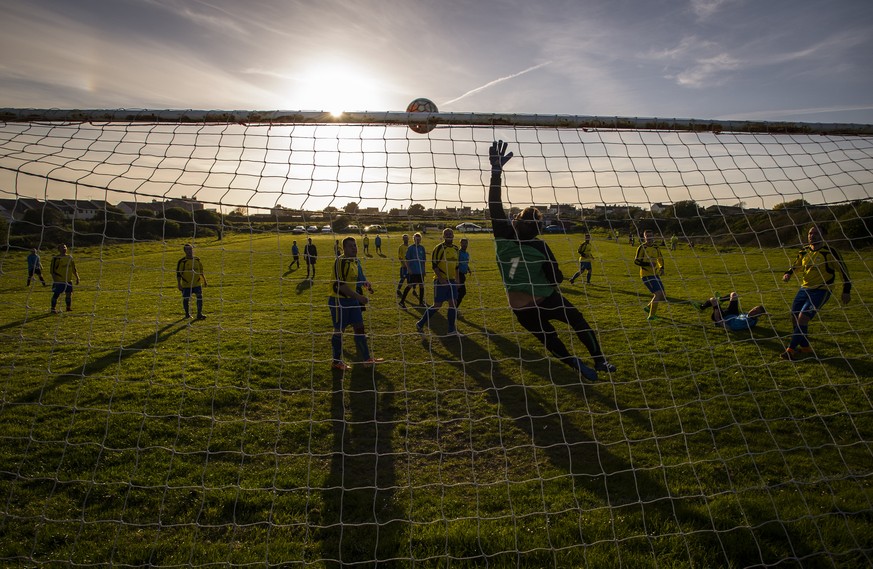 PORTLAND, ENGLAND - APRIL 11: A general view of the action during an amateur non league football match at sunset on April 11, 2017 in Portland, England. (Photo by Justin Setterfield/Getty Images)