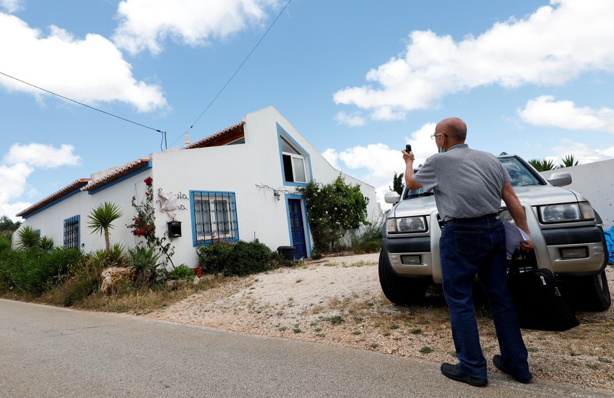 A reporter takes a picture of the house where the suspect lived when three-year-old Madeleine McCann disappeared in 2007, near Lagos, Portugal, June 4, 2020. REUTERS/Rafael Marchante