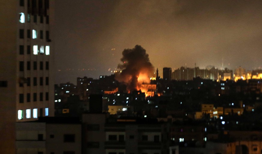 May 5, 2019 - Gaza City, Gaza Strip, Palestinian Territory - Smoke and flames rise during an Israeli airstrike on a building in Gaza city on May 05, 2019. Gaza militants on Saturday fired some 250 roc ...