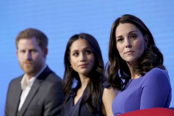 FILE - In this Wednesday, Feb. 28, 2018 file photo, Britain&#039;s Kate, Duchess of Cambridge, right, with Prince Harry and his fiancee Meghan Markle attend the first annual Royal Foundation Forum in  ...