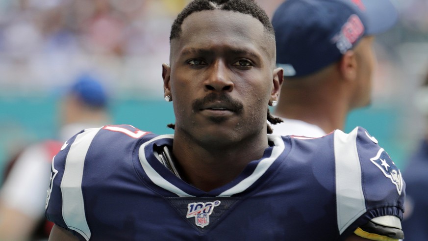 FILE - In this Sunday, Sept. 15, 2019, file photo, New England Patriots wide receiver Antonio Brown (17) on the sidelines,during the first half at an NFL football game against the Miami Dolphins in Mi ...