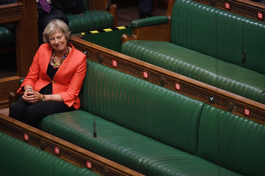 Maidenhead MP Theresa May smiles during question period at the House of Commons in London, Britain June 3, 2020. UK Parliament/Jessica Taylor/Handout via REUTERS THIS IMAGE HAS BEEN SUPPLIED BY A THIR ...