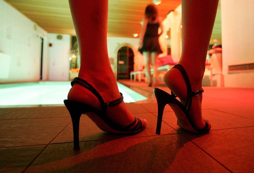 BERLIN - MAY 16: Escort girls await customers at Berlin&#039;s exclusive Night Club Bel Ami on May 16, 2006 in Berlin, Germany. Escort girls across Germany are anticipating booming business in June as ...