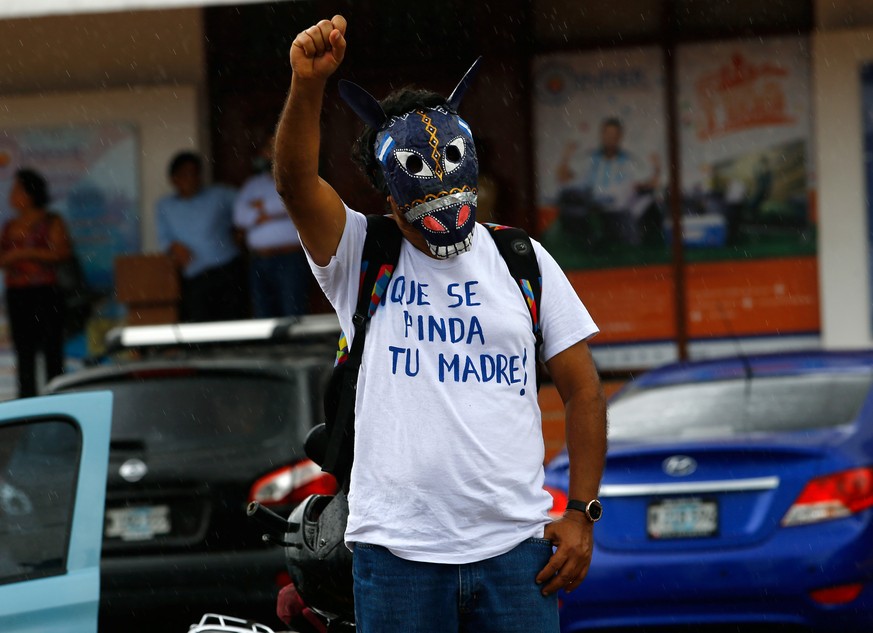 A demonstrator wearing a traditional mask takes part in a march called &quot;Together we are a volcano&quot; against Nicaragua&#039;s President Daniel Ortega&#039;s government in Managua, Nicaragua Ju ...