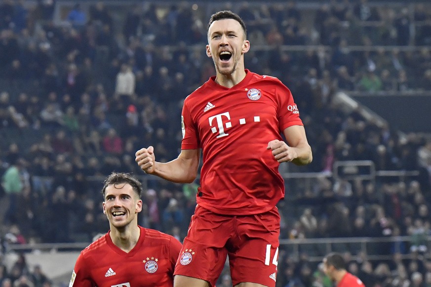 Bayern&#039;s Ivan Perisic, top, celebrates after scoring his side&#039;s first goal during the German Bundesliga soccer match between Borussia Moenchengladbach and Bayern Munich at the Borussia Park  ...
