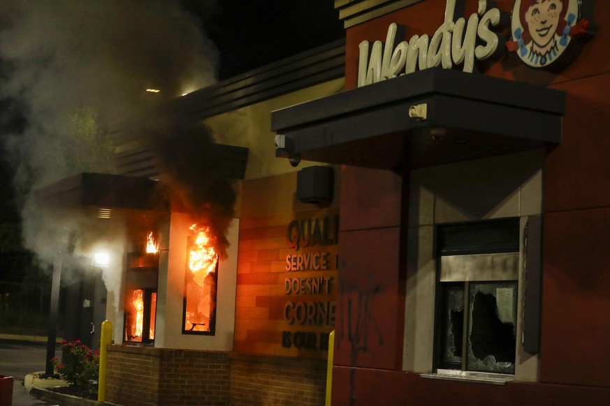 A Wendy&#039;s restaurant is on fire during protests on Saturday, June 13, 2020, where Rayshard Brooks was shot and killed by police Friday evening following a struggle in the restaurant&#039;s drive- ...