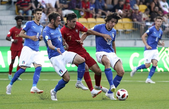 Italy&#039;s Gianmaria Zanandrea and Sandro Tonali, right, challenge Portugal&#039;s Joao Filipe for the ball during the European Under-19 Championship soccer final match between Italy and Portugal in ...