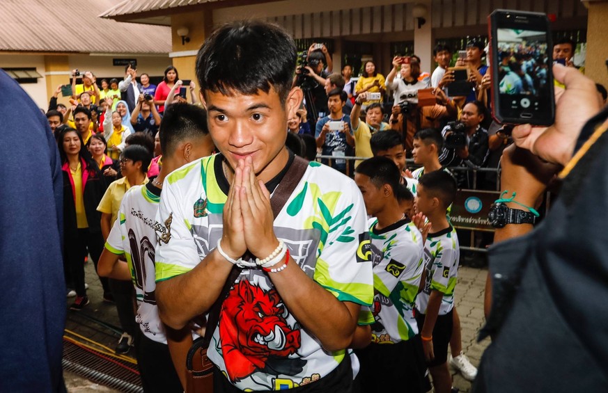 (181227) -- BEIJING, Dec. 27, 2018 -- Photo taken on July 18, 2018 shows the 12 boys and their football coach rescued from a flooded cave in northern Thailand make their first public appearance at a p ...