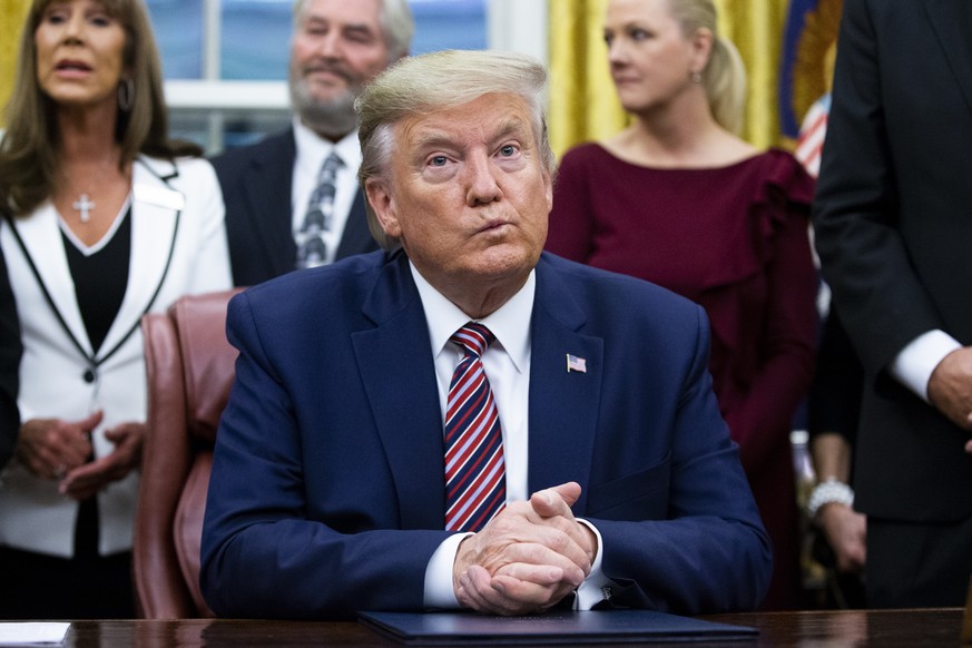 US President Donald J. Trump C participates in a signing ceremony for H.R. 724, the Preventing Animal Cruelty and Torture Act , in the Oval Office of the White House in Washington, DC, USA, 25 Novembe ...