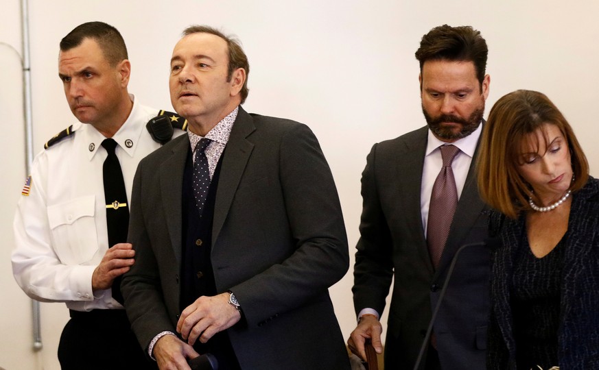 FILE PHOTO: Actor Kevin Spacey, with his lawyers Alan Jackson and Juliane Balliro at his side, is arraigned on a sexual assault charge at Nantucket District Court in Nantucket, Massachusetts, U.S., Ja ...