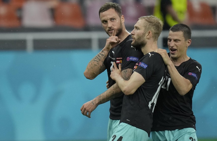 Austria&#039;s Marko Arnautovic, left, celebrates with teammates after scoring his side&#039;s third goal during the Euro 2020 soccer championship group C match between Austria and Northern Macedonia  ...