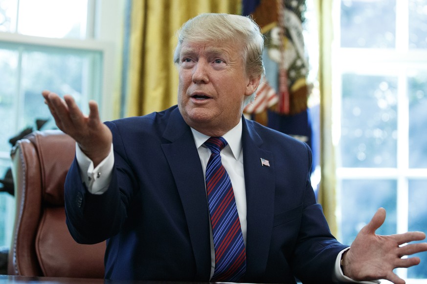President Donald Trump speaks in the Oval Office of the White House in Washington, Friday, July 26, 2019. Trump announced that Guatemala is signing an agreement to restrict asylum applications to the  ...