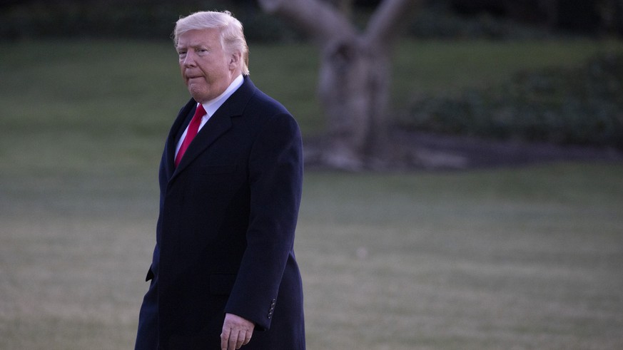 President Donald Trump walks out of the oval office on the South Lawn of the White House in Washington, D.C. on Wednesday, December 18, 2019. The House is expected to vote on articles of impeachment a ...