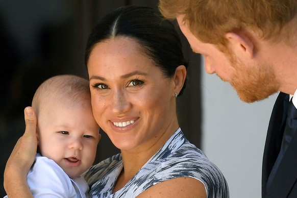 FILE PHOTO: Britain&#039;s Prince Harry and his wife Meghan, Duchess of Sussex holding their son Archie, meet Archbishop Desmond Tutu (not pictured) at the Desmond &amp; Leah Tutu Legacy Foundation in ...