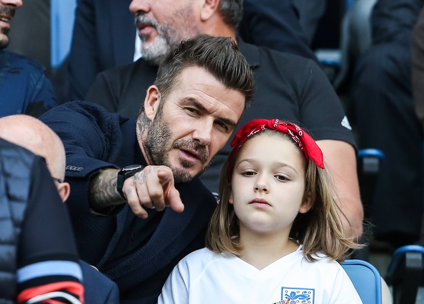 (190628) -- LE HAVRE (FRANCE), June 28, 2019 -- England s football legend David Beckham and his daughter Harper Beckham attend the quarterfinal between England and Norway at the 2019 FIFA Women s Worl ...