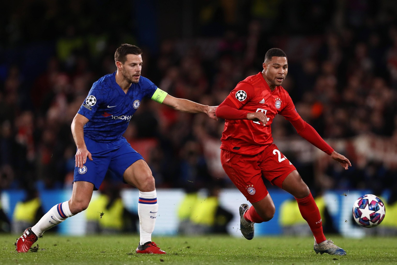 February 25, 2020, London, United Kingdom: Serge Gnabry of Bayern Munich and Cesar Azpilicueta of Chelsea in action during the UEFA Champions League Round 16 First Leg match between Chelsea and Bayern ...