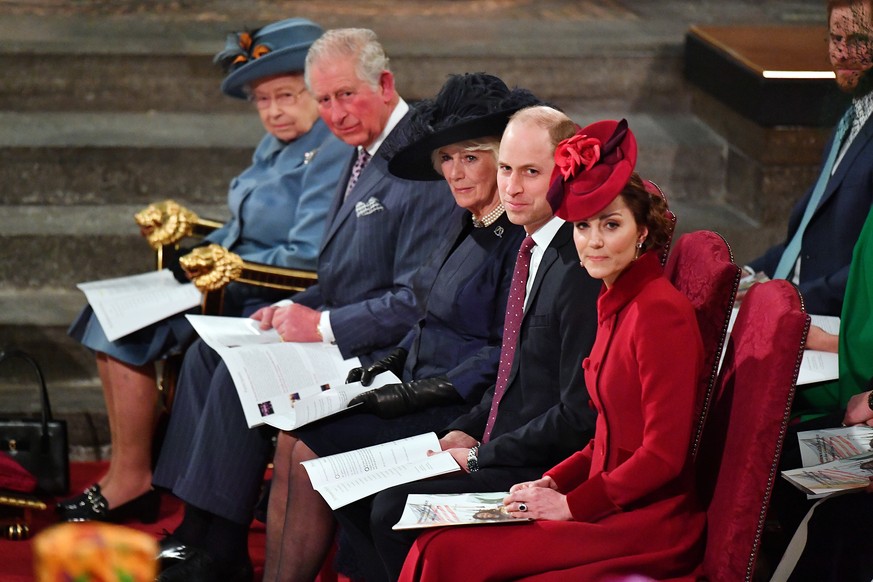Britain&#039;s Queen Elizabeth II, Prince Charles, Camilla, Duchess of Cornwall, Prince Harry and Meghan, Duchess of Sussex, and Prince William and Catherine, Duchess of Cambridge attend the annual Co ...