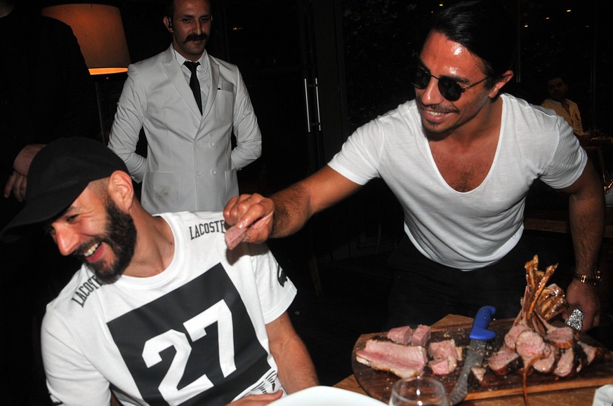 Real Madrid player Karim Benzema visits Turkey for muslims holy Ramadan iftar. Benzema eats meat at Nusret Restaurant. Restraurants owner and chief Nusret Gokce serves the meat to Karim Benzema. PUBLI ...