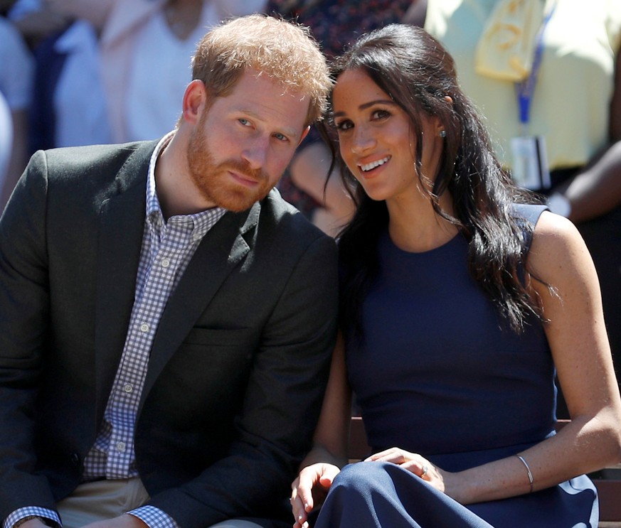 FILE PHOTO: Britain&#039;s Prince Harry and his wife Meghan, Duchess of Sussex, watch a performance during their visit to Macarthur Girls High School in Sydney, Australia October 19, 2018. REUTERS/Phi ...