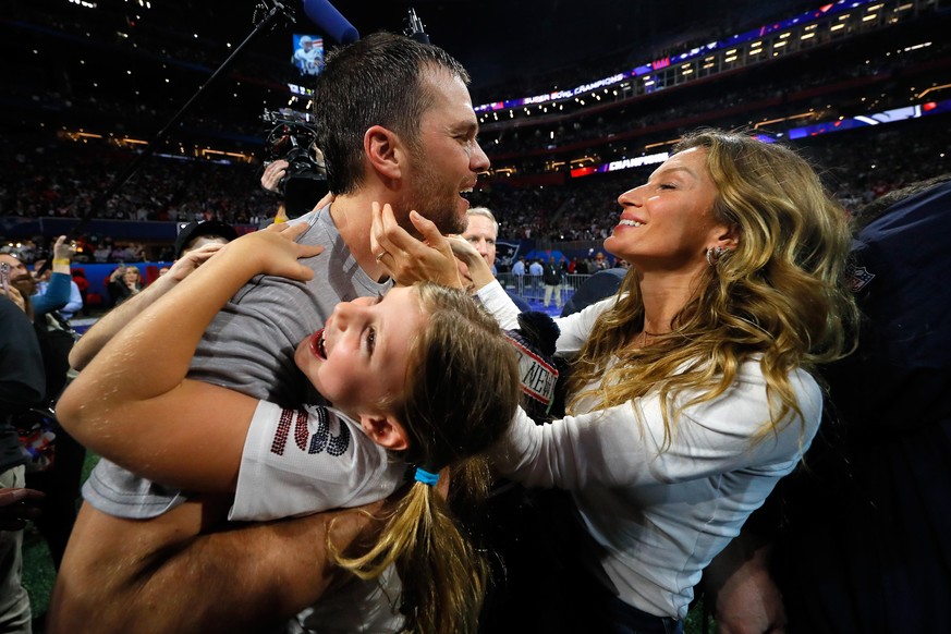 ATLANTA, GA - FEBRUARY 03: Tom Brady #12 of the New England Patriots celebrates with his wife Gisele Bündchen after the Super Bowl LIII against the Los Angeles Rams at Mercedes-Benz Stadium on Februar ...